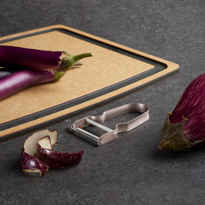 Victorinox REX Straight-edge Peeler in Blueberry Effortlessly Peeling Eggplant