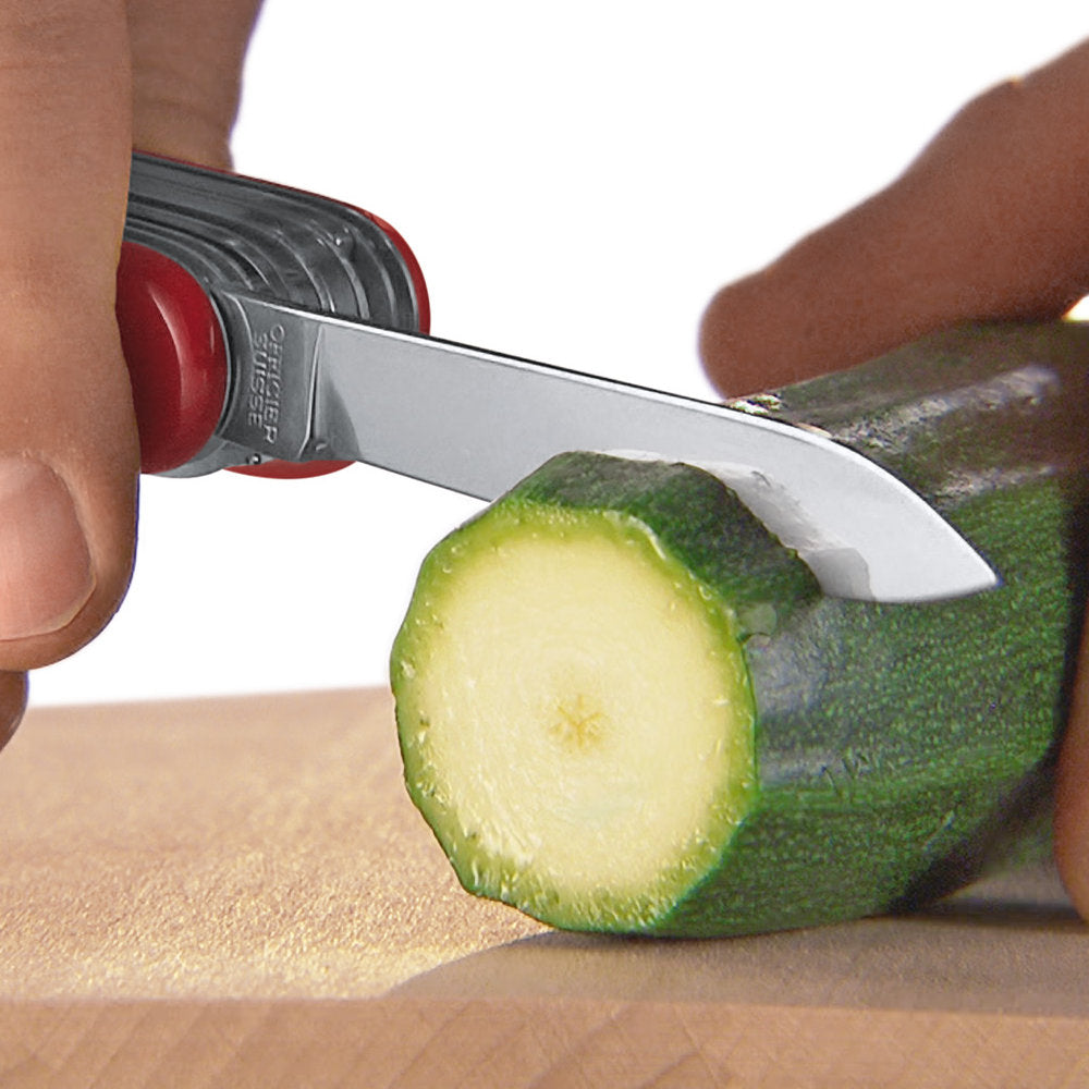 SwissChamp Swiss Army Knife by Victorinox Slicing a Cucumber